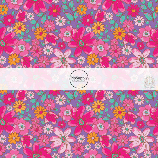  These floral themed purple fabric by the yard features hot pink, light pink, orange, and aqua flowers on purple. This fun summer floral themed fabric can be used for all your sewing and crafting needs! 
