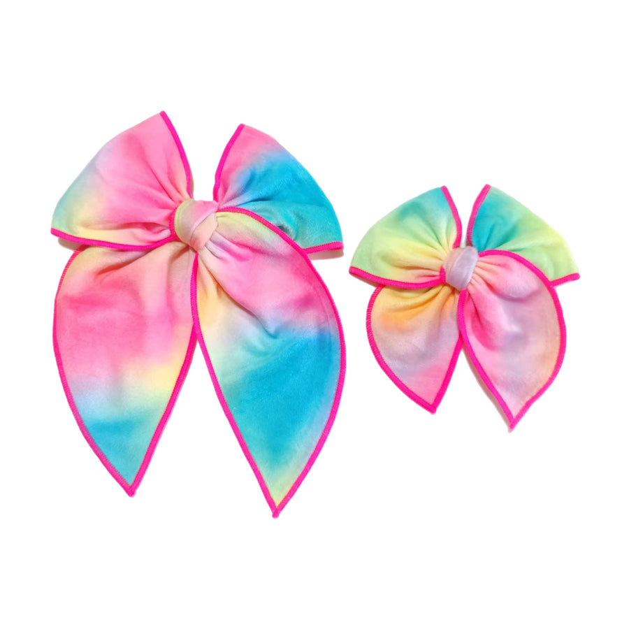 These spring rainbow serged edge pre-cut tied bows are ready to package and resell to your customers no sewing or measuring necessary! These hair bows come with a clip already attached.