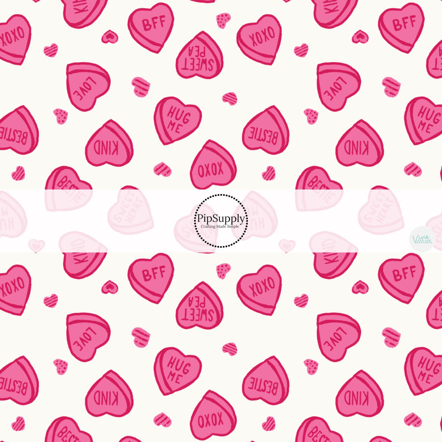 This holiday fabric by the yard features Valentine heart candy. This festive pattern fabric can be used for all your sewing and crafting needs!