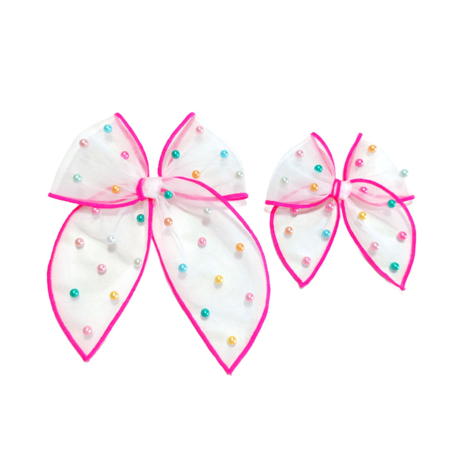 These spring tulle serged edge pre-cut tied bows with pearls are ready to package and resell to your customers no sewing or measuring necessary! These hair bows come with a clip already attached.