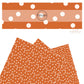 These dot themed faux leather sheets contain the following design elements: small white dots on orange. Our CPSIA compliant faux leather sheets or rolls can be used for all types of crafting projects.
