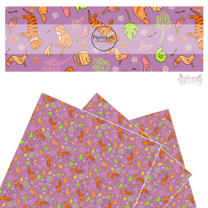 These jungle animal themed purple faux leather sheets contain the following design elements: lions, birds, snakes, monkeys, toucans, bananas, leaves and flowers. 