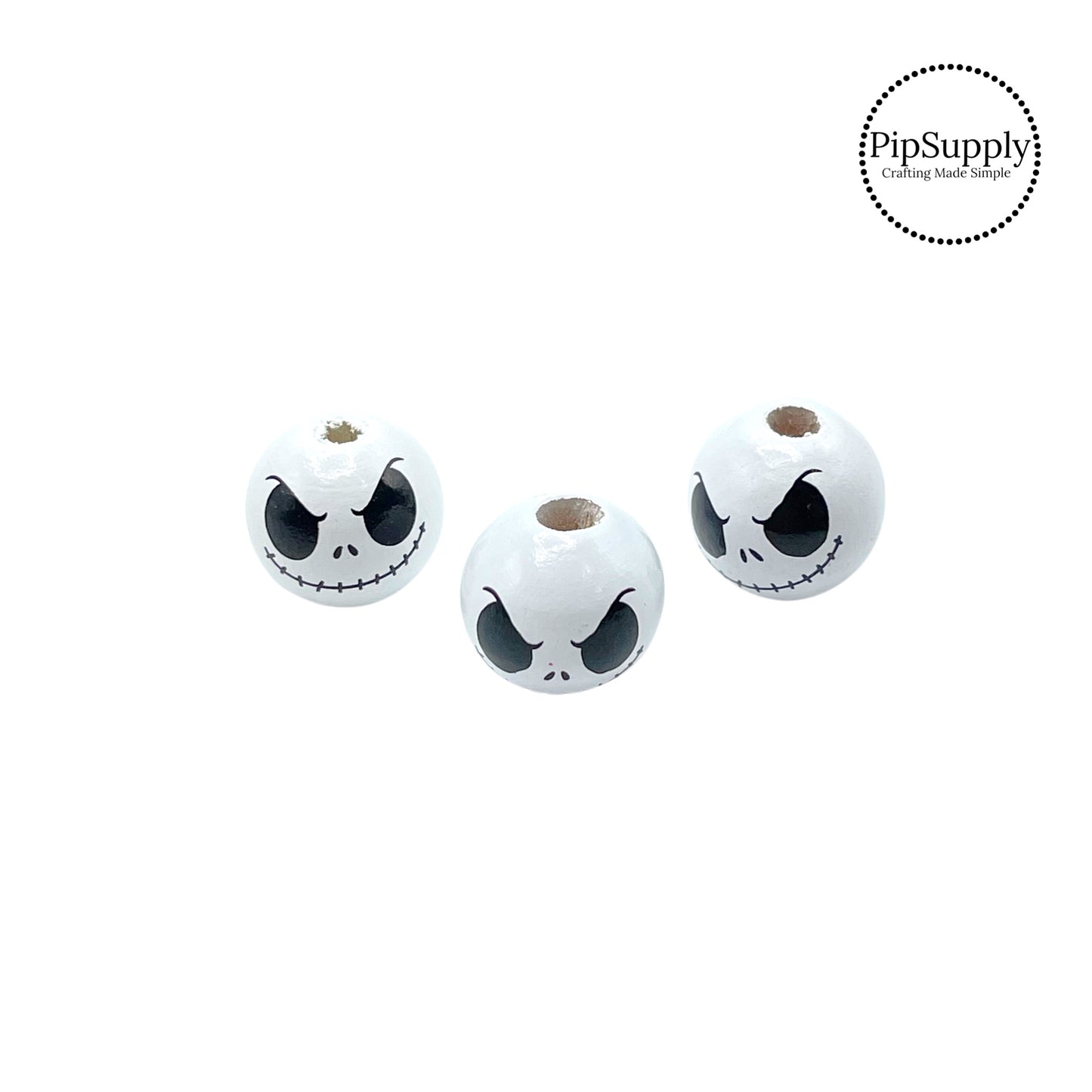 Black eyes and mouth on white wooden beads