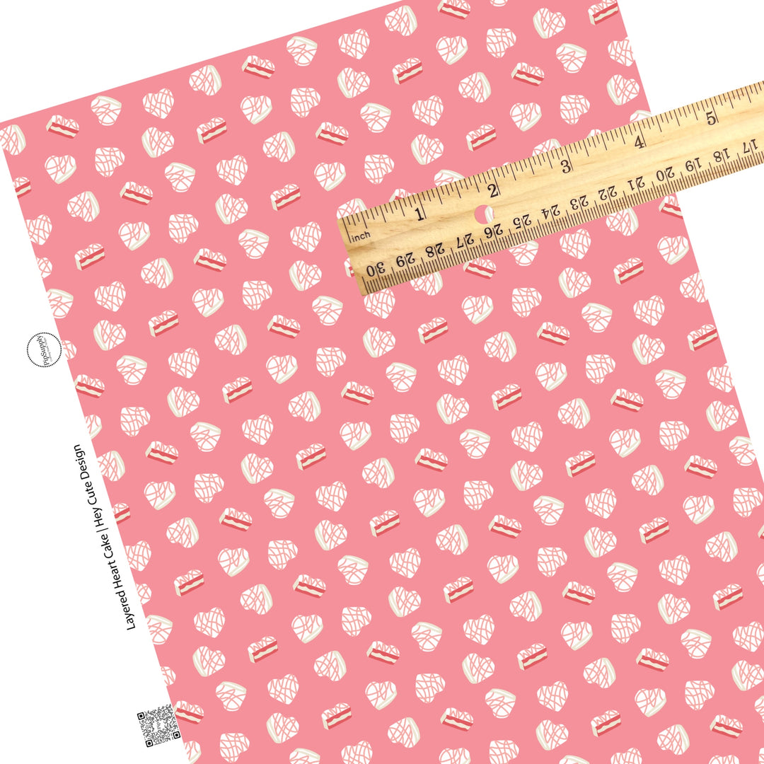 These Valentine's pattern themed faux leather sheets contain the following design elements: cream heart shaped cakes on pink. Our CPSIA compliant faux leather sheets or rolls can be used for all types of crafting projects.