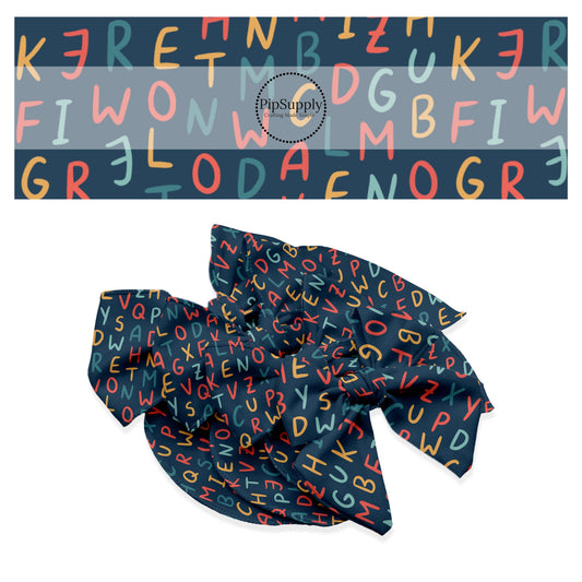Red, blue, and orange capital letters on navy hair bow strips