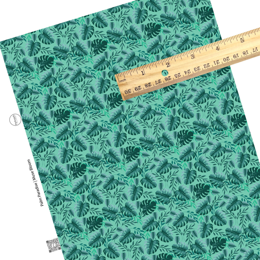 Dark green palms on aqua faux leather sheet. 