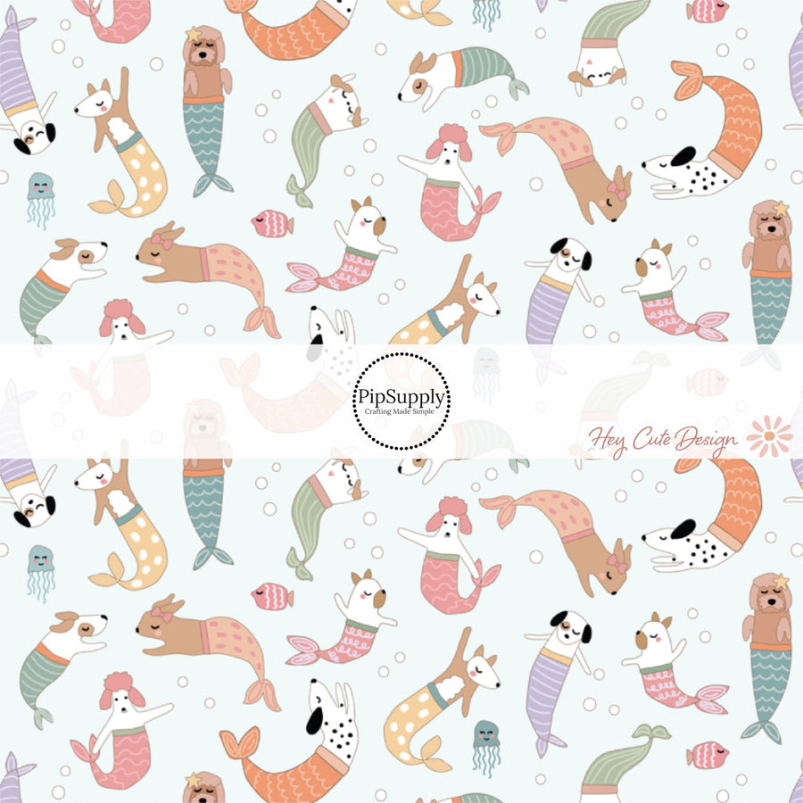 This beach fabric by the yard features mermaid dogs on light aqua. This fun summer themed fabric can be used for all your sewing and crafting needs!