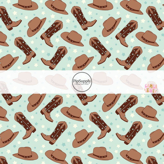 These western themed light blue pattern fabric by the yard features light blue and brown cowgirl hats and cowgirl boots along with tiny blue and cream stars. 