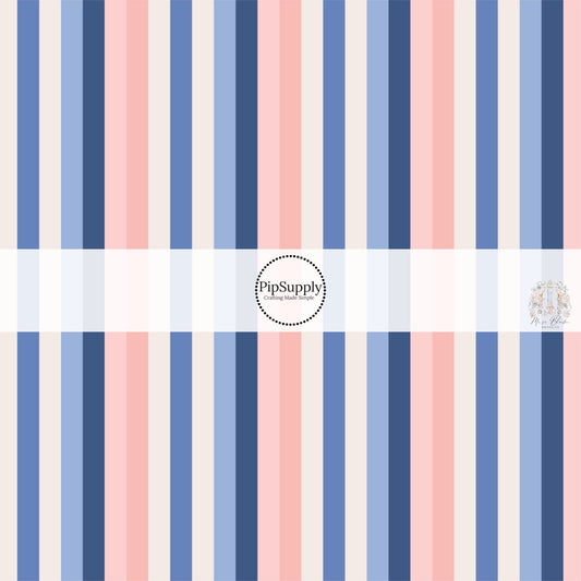 These stripe themed blue, cream, and peach fabric by the yard features white, tan, light pink, light peach, periwinkle and navy blue stripes.