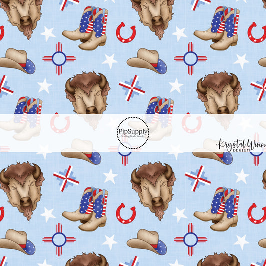 These patriotic and western light blue fabric by the yard features buffalos, horseshoes, white stars, cowboy boots, and cowboy hats.