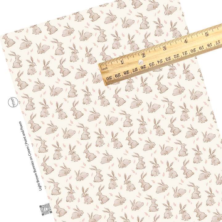 These spring pattern themed faux leather sheets contain the following design elements: light brown bunnies on cream. Our CPSIA compliant faux leather sheets or rolls can be used for all types of crafting projects.