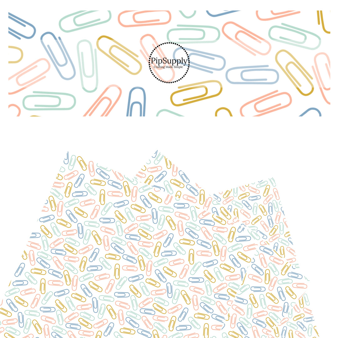 Blue, green, yellow, and pink paper clips on white faux leather sheets