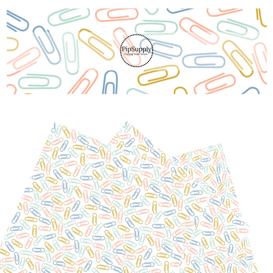 Blue, green, yellow, and pink paper clips on white faux leather sheets