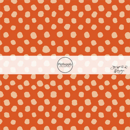 Scattered beige dots on rust hair bow strips