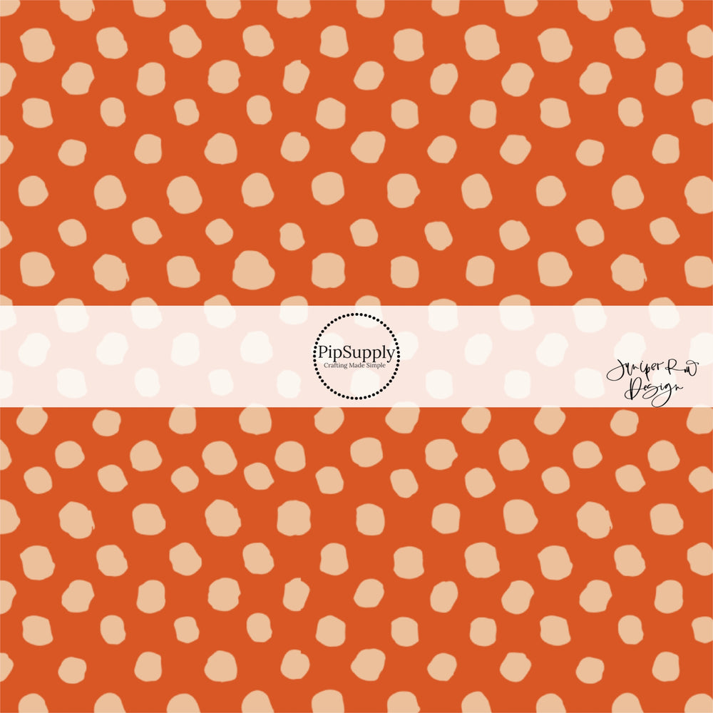 Scattered beige dots on rust hair bow strips