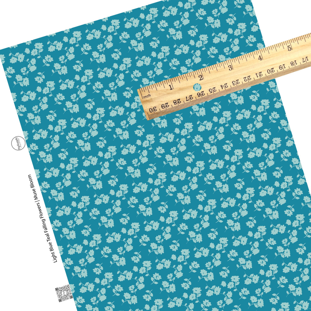 These floral themed dark teal faux leather sheets contain the following design elements: light blue flowers on dark teal. 