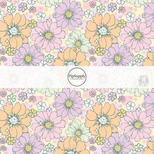 Light pink, purple, orange, and white flowers on a purple and cream checker board pattern fabric by the yard.