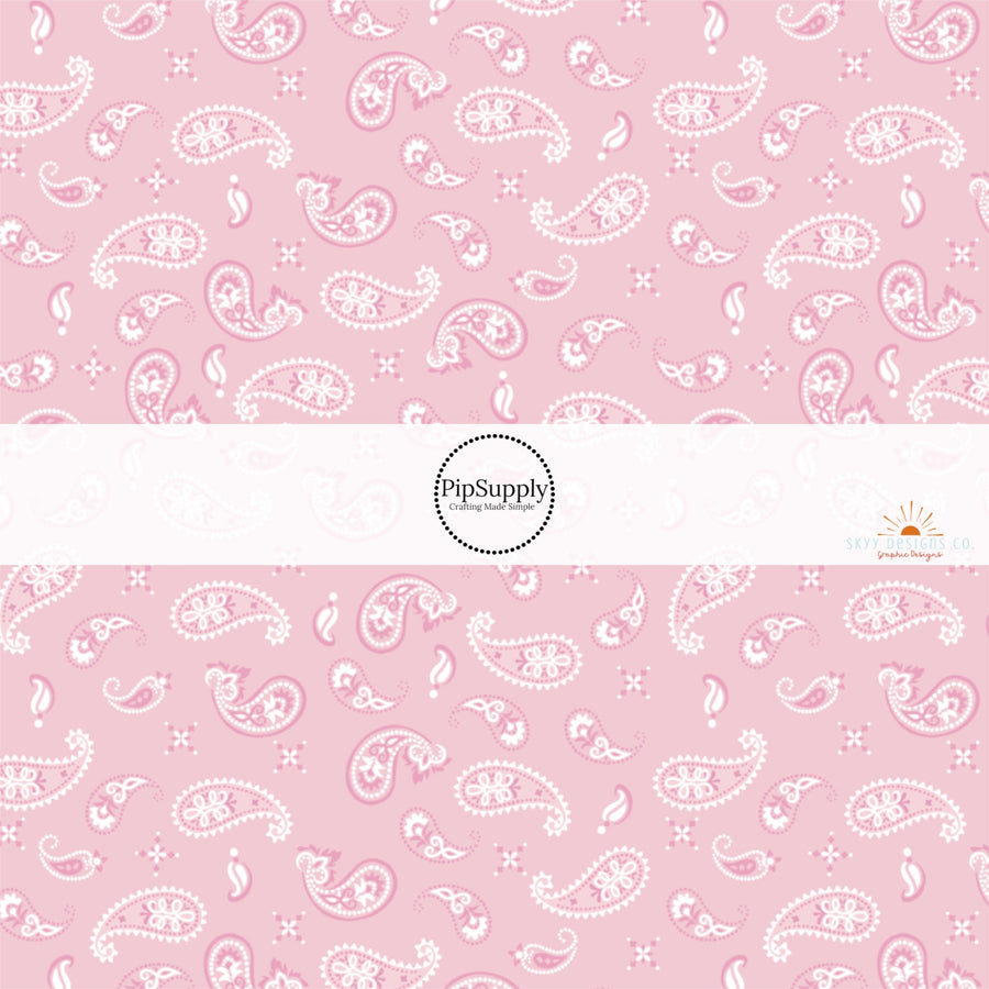 Pastel pink bandana pattern western themed fabric by the yard. 