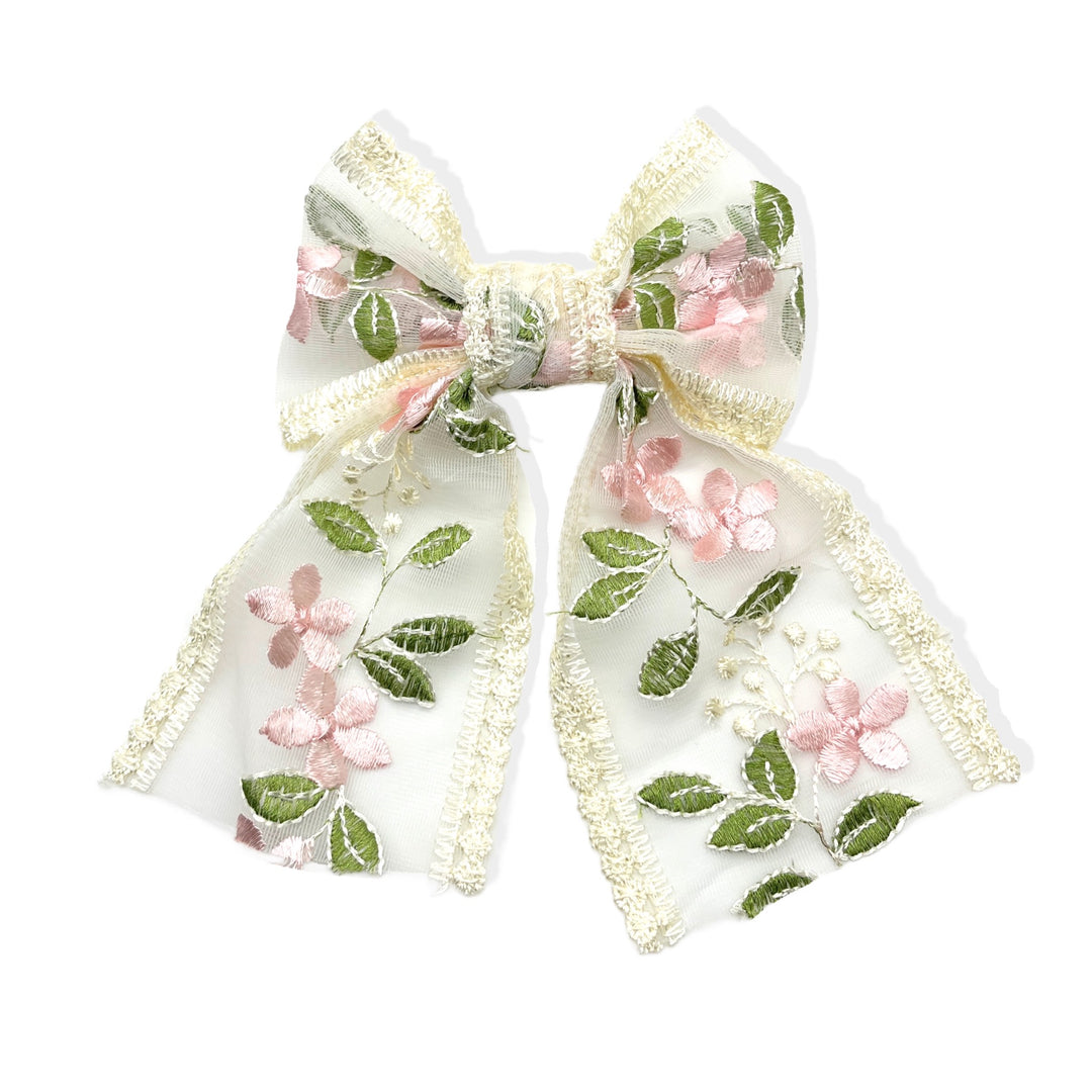 These spring pink floral with green leaves embroidered pre-cut tied bows are ready to package and resell to your customers no sewing or measuring necessary! These hair bows come with a alligator clip already attached.