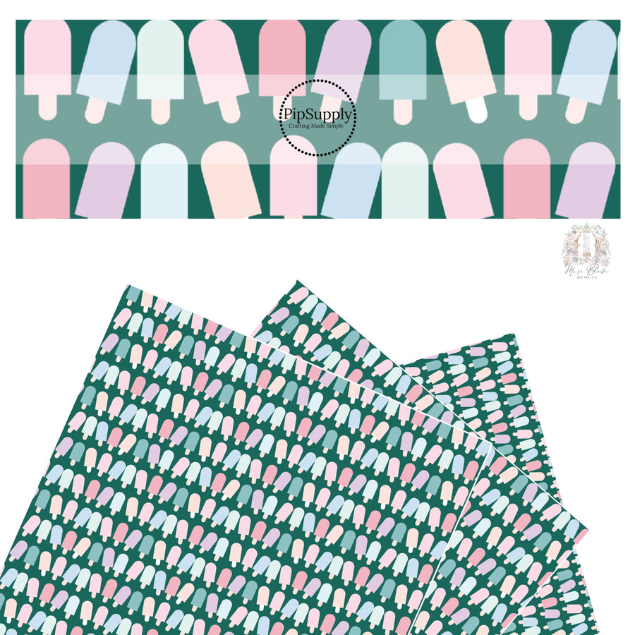 Light pink, light purple, light blue, aqua, light yellow popsicles on dark green faux leather sheet.