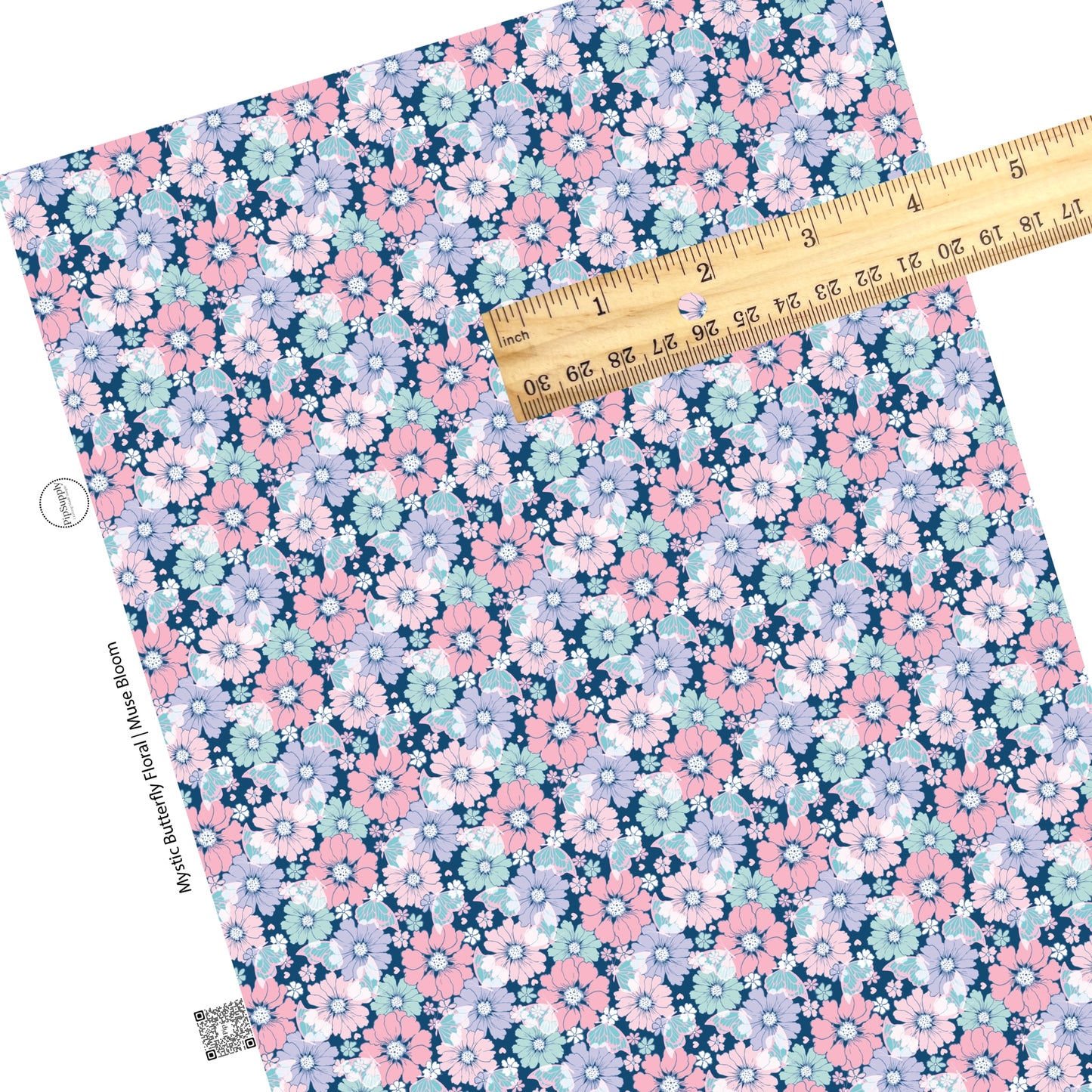 Light colored flowers in pink, aqua, purple, and white with aqua butterflies on dark navy blue faux leather sheet.
