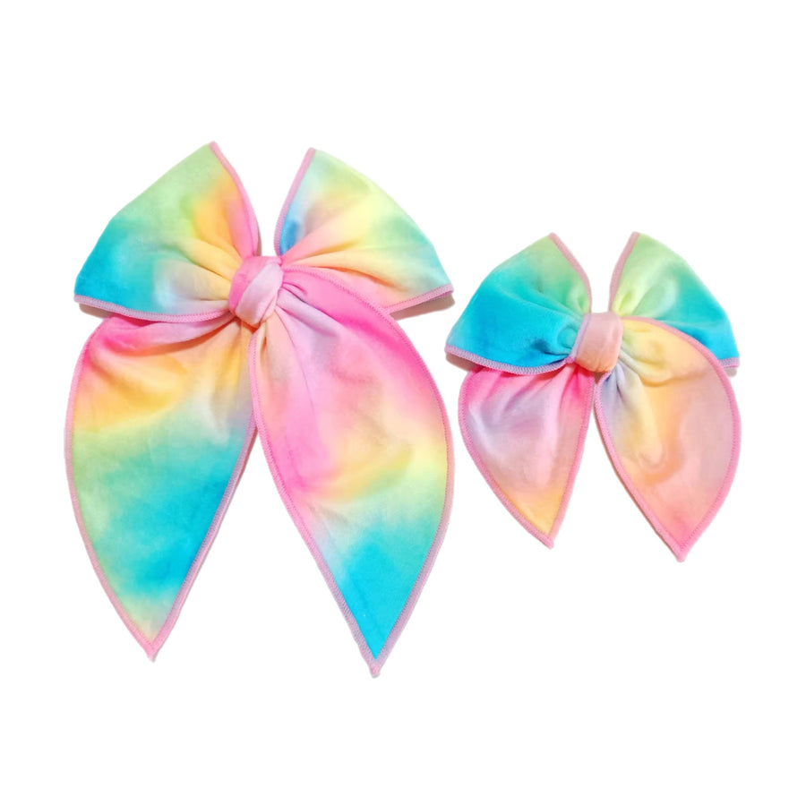 These spring rainbow serged edge pre-cut tied bows are ready to package and resell to your customers no sewing or measuring necessary! These hair bows come with a clip already attached.