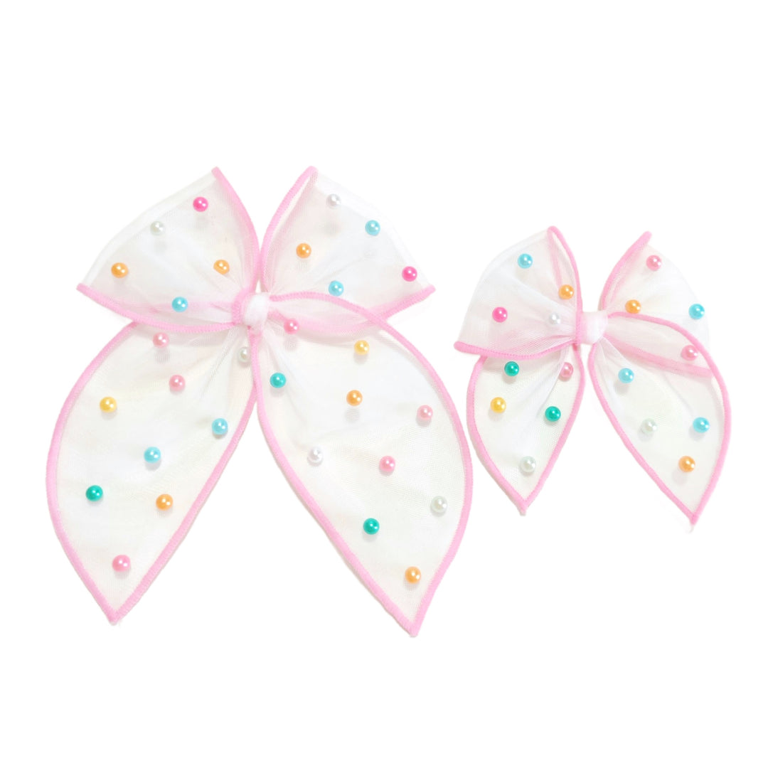 These spring tulle serged edge pre-cut tied bows with pearls are ready to package and resell to your customers no sewing or measuring necessary! These hair bows come with a clip already attached.