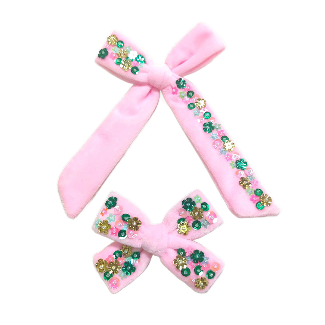 These spring light pink velvet multi sequin tied bows are ready to package and resell to your customers no sewing or measuring necessary! These hair bows come with a alligator clip already attached. Along with multi color floral sequins.