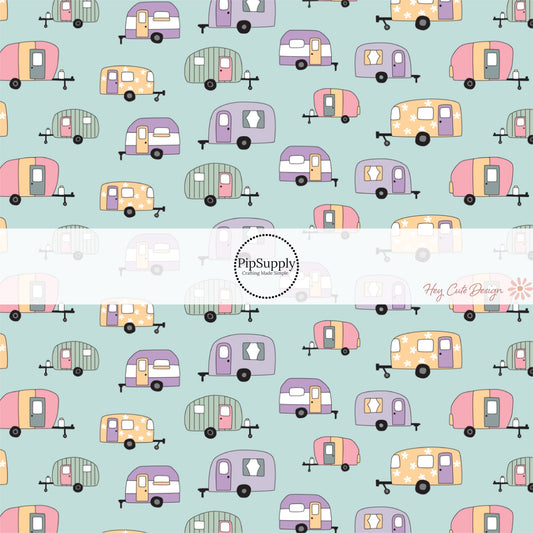 These camping outdoor light blue fabric by the yard features pastel pink, cream, and green campers on pastel blue. This fun camping themed fabric can be used for all your sewing and crafting needs! 