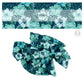 Light blue and aqua tropical flowers and palms on dark navy hair bow strips. 