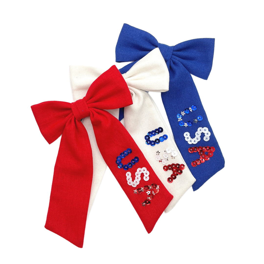 These patriotic linen pre-cut tied bows are ready to package and resell to your customers no sewing or measuring necessary! These hair bows come with a clip already attached. The linen bow has "USA" sequins.