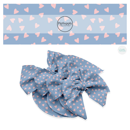Scattered pink hearts on blue hair bow strips