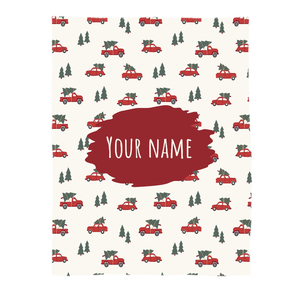 This Christmas designer pattern is printed onto the front side of our soft touch minky blankets. The backside will not be printed and left the natural cream/white color of the blanket. This print pattern features red trucks carrying Christmas trees on cream.