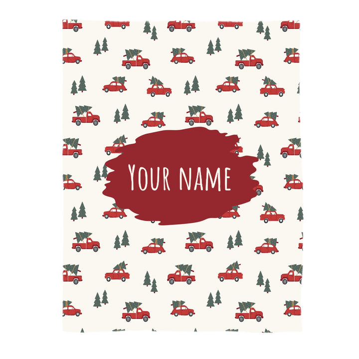 This Christmas designer pattern is printed onto the front side of our soft touch minky blankets. The backside will not be printed and left the natural cream/white color of the blanket. This print pattern features red trucks carrying Christmas trees on cream.