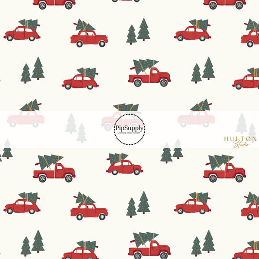 These Christmas themed pattern fabric by the yard features the following design elements: red trucks carrying Christmas trees on cream. This fun themed fabric can be used for all your sewing and crafting needs!