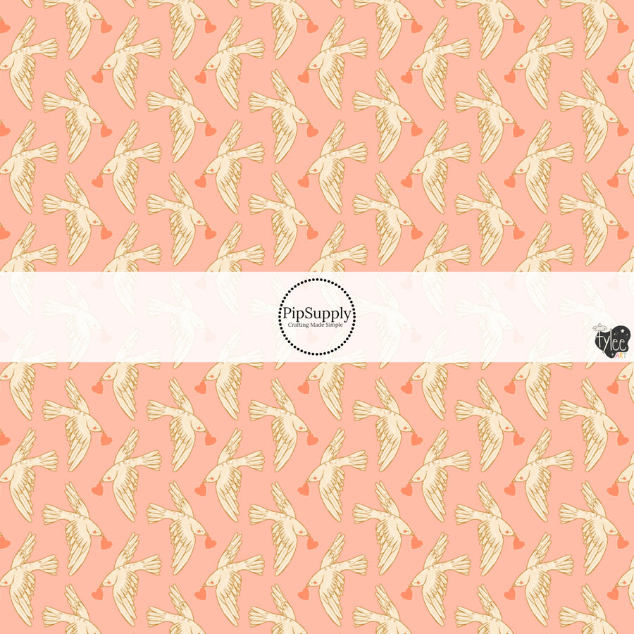 This holiday fabric by the yard features love doves on pink. This festive pattern fabric can be used for all your sewing and crafting needs!