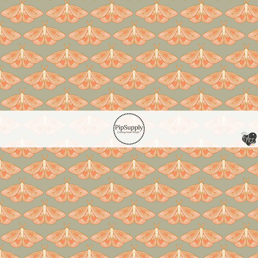 This holiday fabric by the yard features moths on sage. This festive pattern fabric can be used for all your sewing and crafting needs!