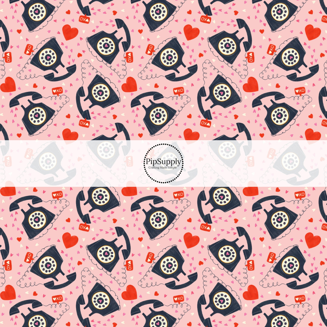 This holiday fabric by the yard features telephones and hearts. This festive pattern fabric can be used for all your sewing and crafting needs!