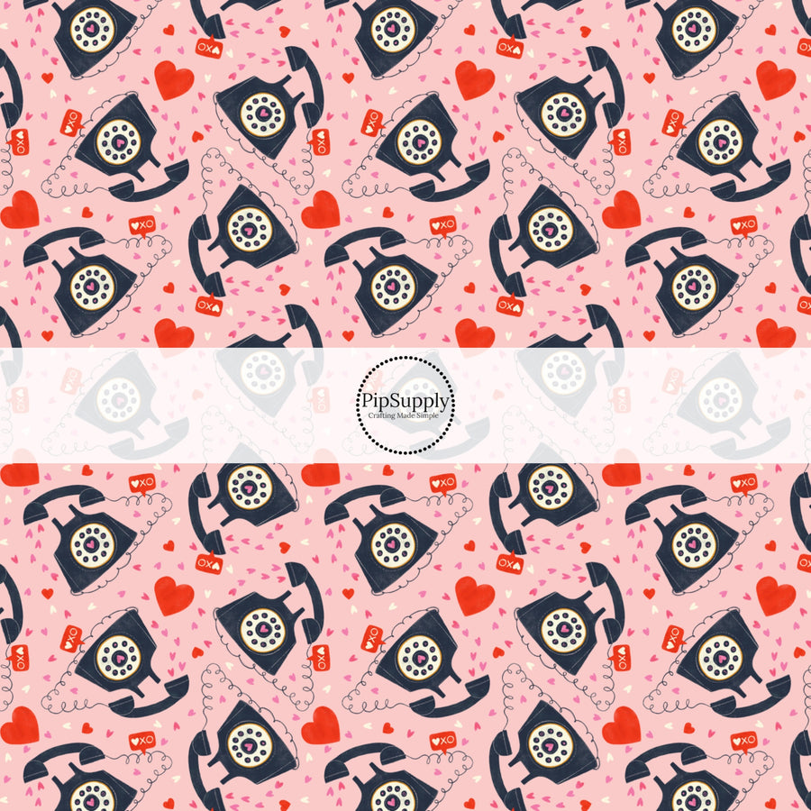 This holiday fabric by the yard features telephones and hearts. This festive pattern fabric can be used for all your sewing and crafting needs!