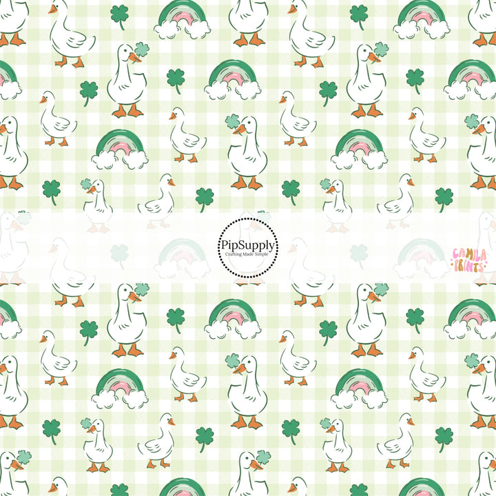 This holiday fabric by the yard features ducks and rainbows on light green and cream checkers. This festive pattern fabric can be used for all your sewing and crafting needs!