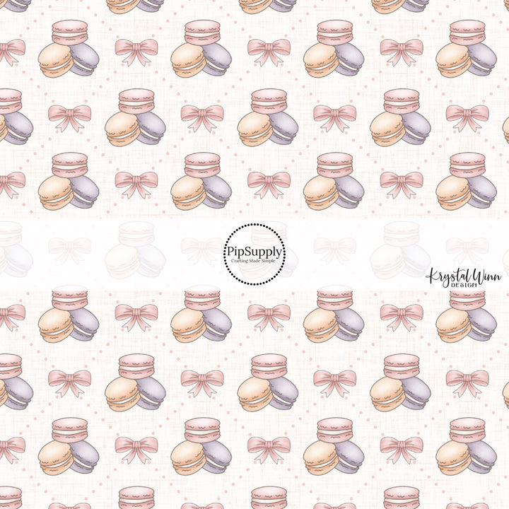 This Easter fabric by the yard features pink bows and pastel macaroons. This fun pattern fabric can be used for all your sewing and crafting needs!