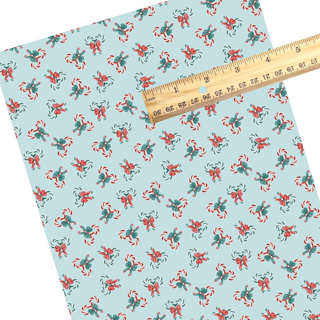 These winter themed pattern faux leather sheets contain the following design elements: candy canes on mint. Our CPSIA compliant faux leather sheets or rolls can be used for all types of crafting projects.