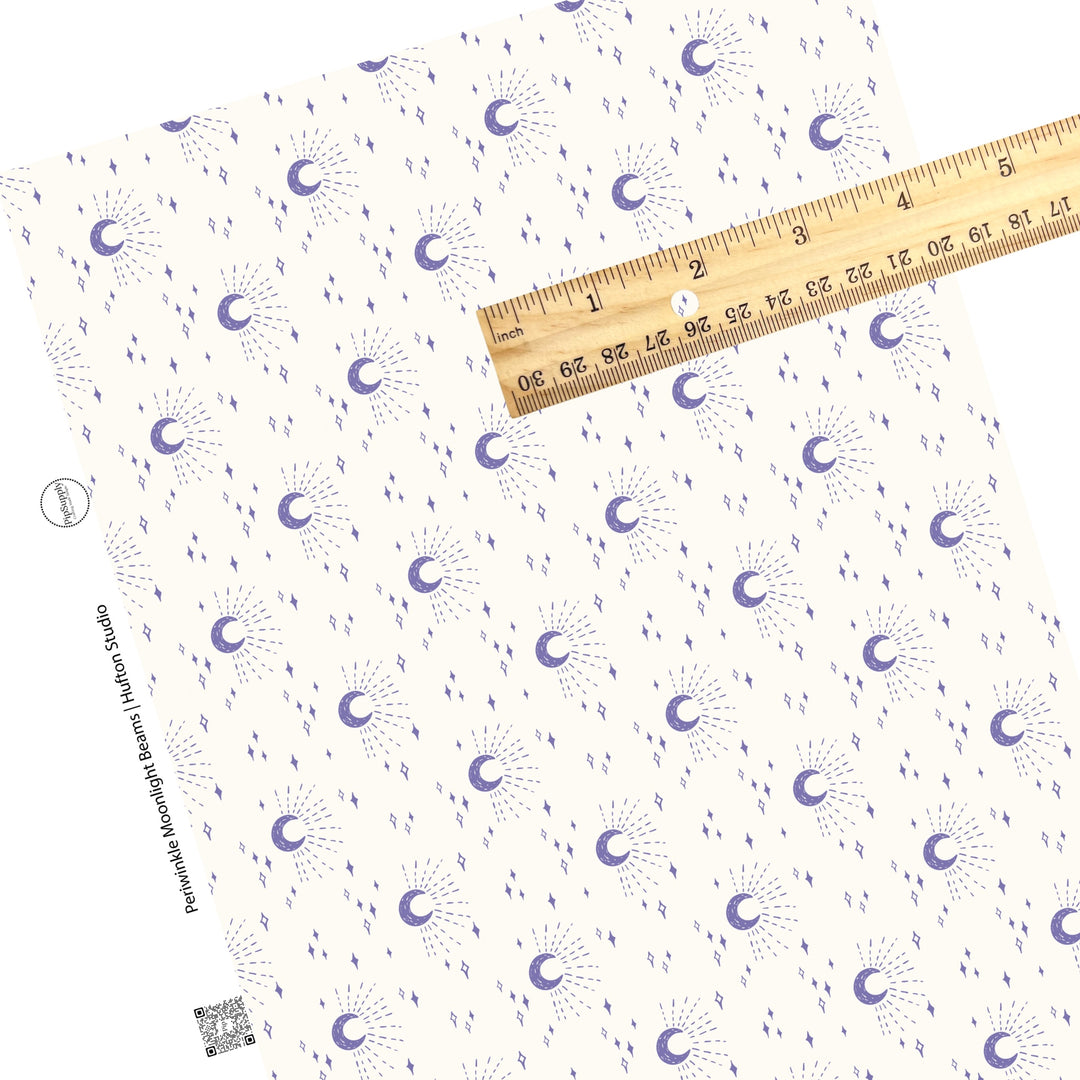 These moon themed light cream faux leather sheets contain the following design elements: purple crescent moons surrounded by moonlight beams and small stars on ivory.  Our CPSIA compliant faux leather sheets or rolls can be used for all types of crafting projects. 