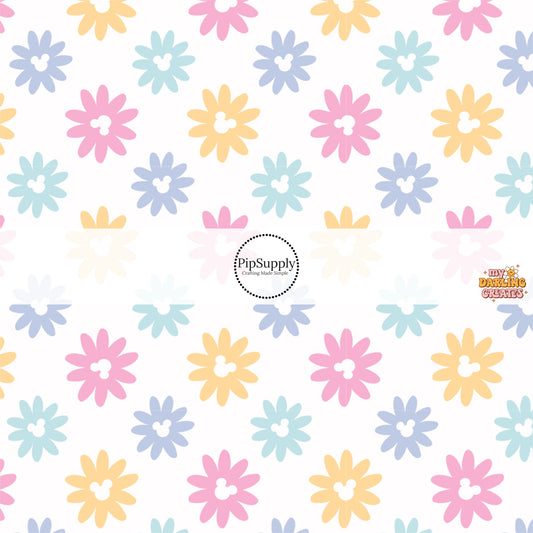 This magical inspired fabric by the yard features the following design: multi colored daisies with mouse ears on cream. This fun themed fabric can be used for all your sewing and crafting needs!