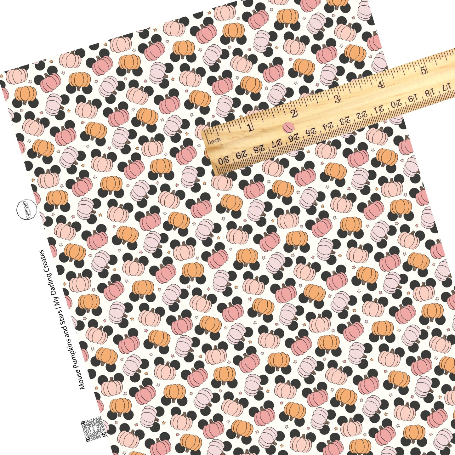 Scattered mouse head pumpkins and stars on cream faux leather sheets