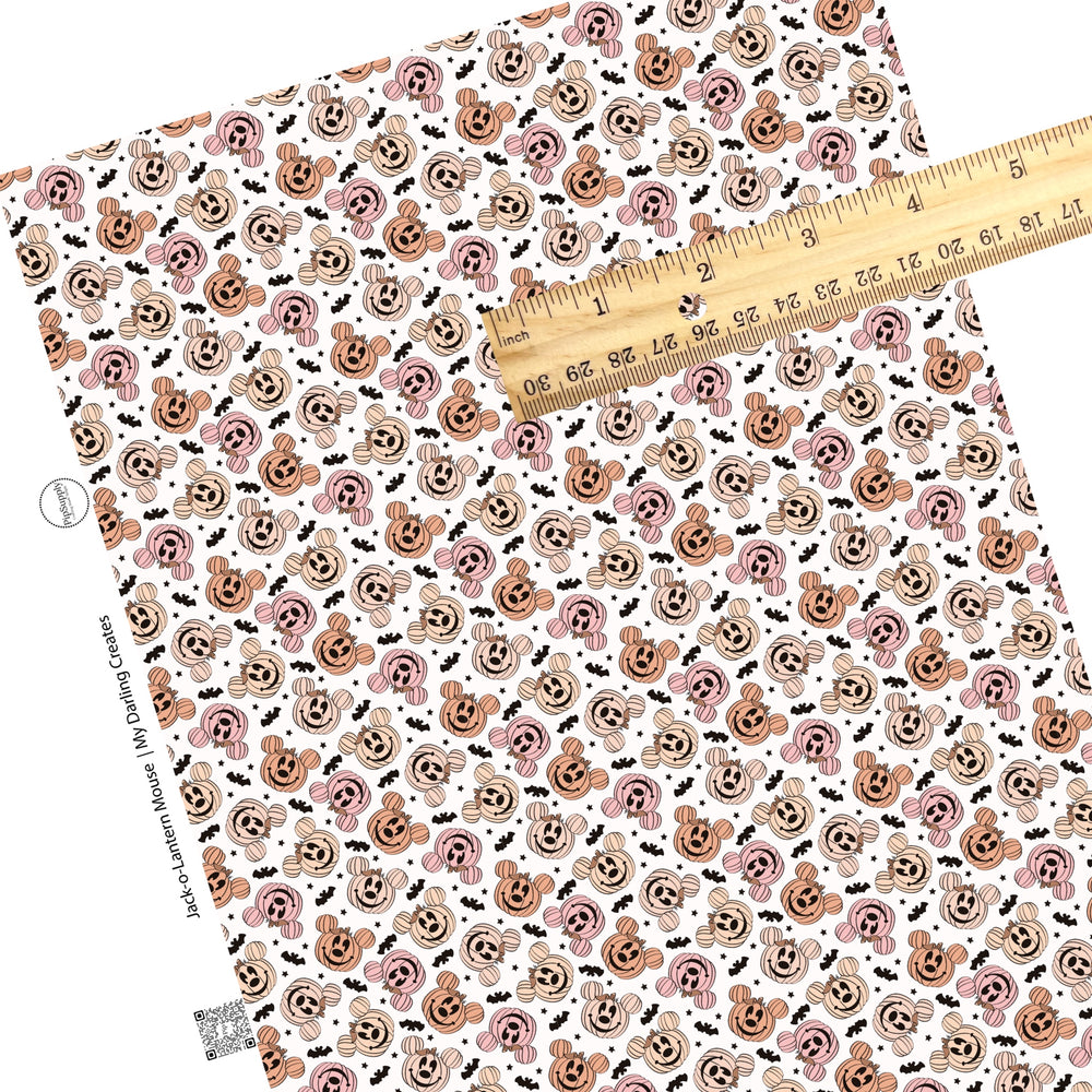 Mouse ear pumpkins and bats with stars on white faux leather sheets