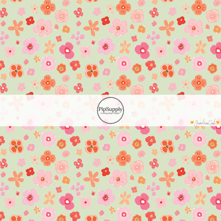 This spring themed fabric by the yard features colorful flowers on seafoam green. This fun pattern fabric can be used for all your sewing and crafting needs!