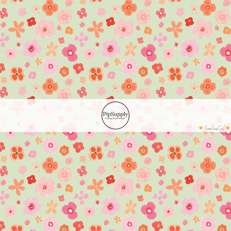 This spring themed fabric by the yard features colorful flowers on seafoam green. This fun pattern fabric can be used for all your sewing and crafting needs!