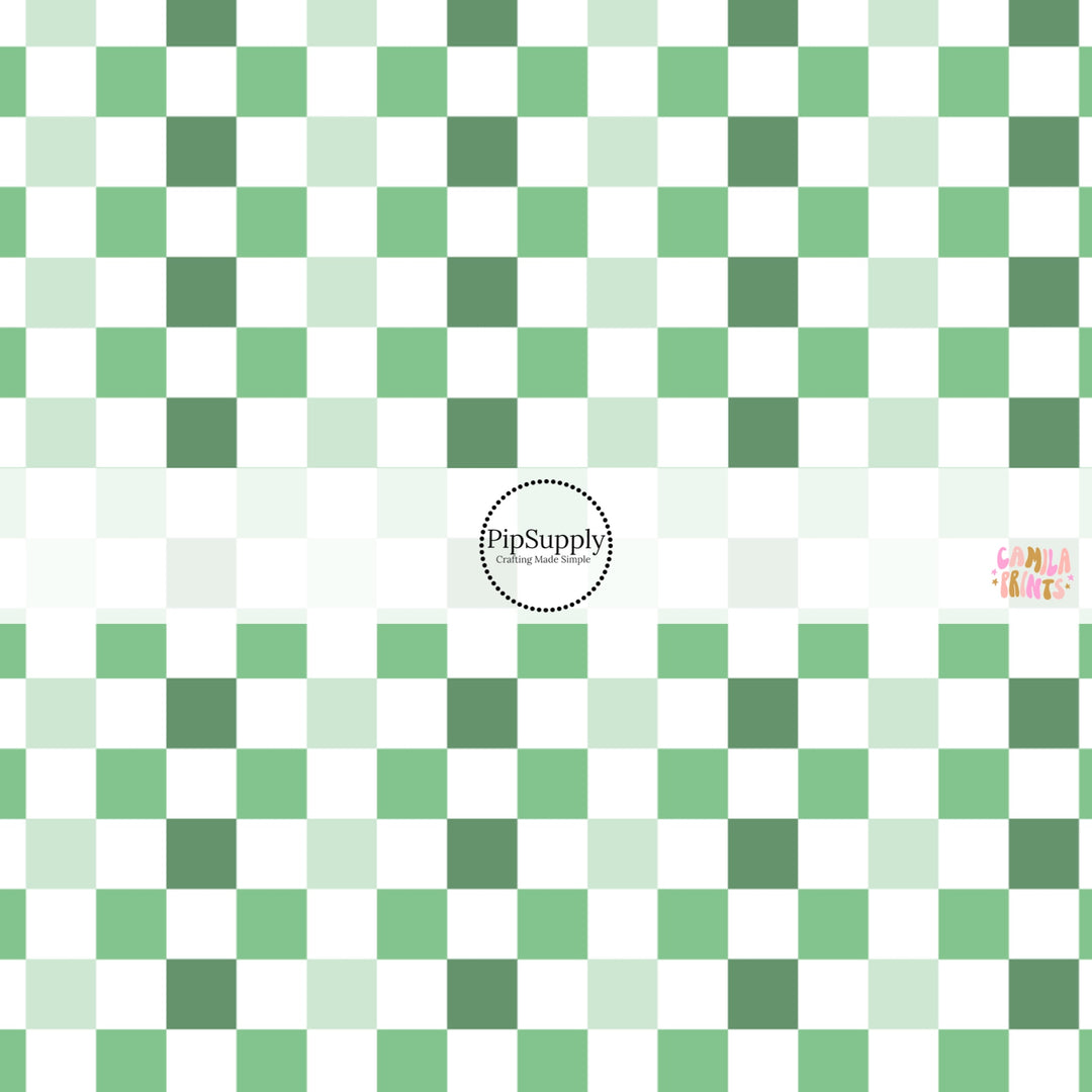 This holiday fabric by the yard features green and cream checkers. This festive pattern fabric can be used for all your sewing and crafting needs!