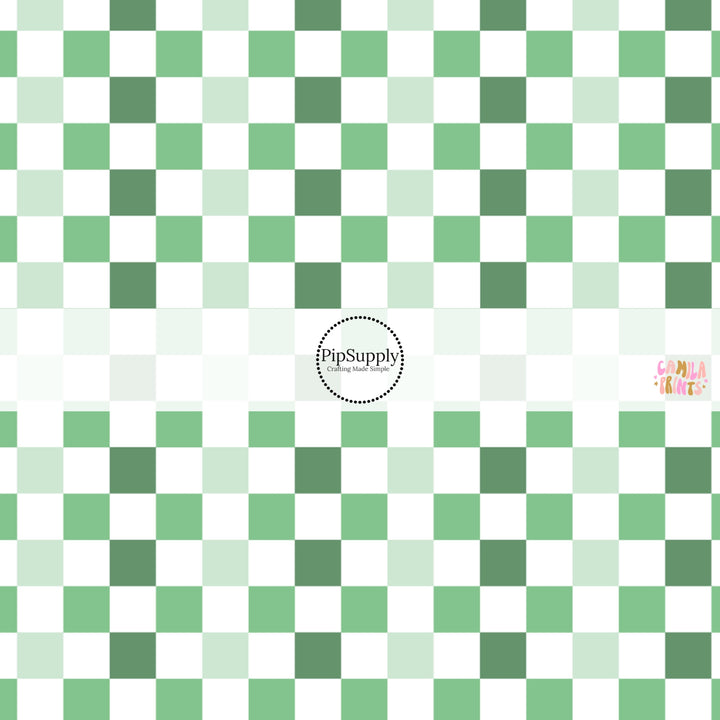 This holiday fabric by the yard features green and cream checkers. This festive pattern fabric can be used for all your sewing and crafting needs!